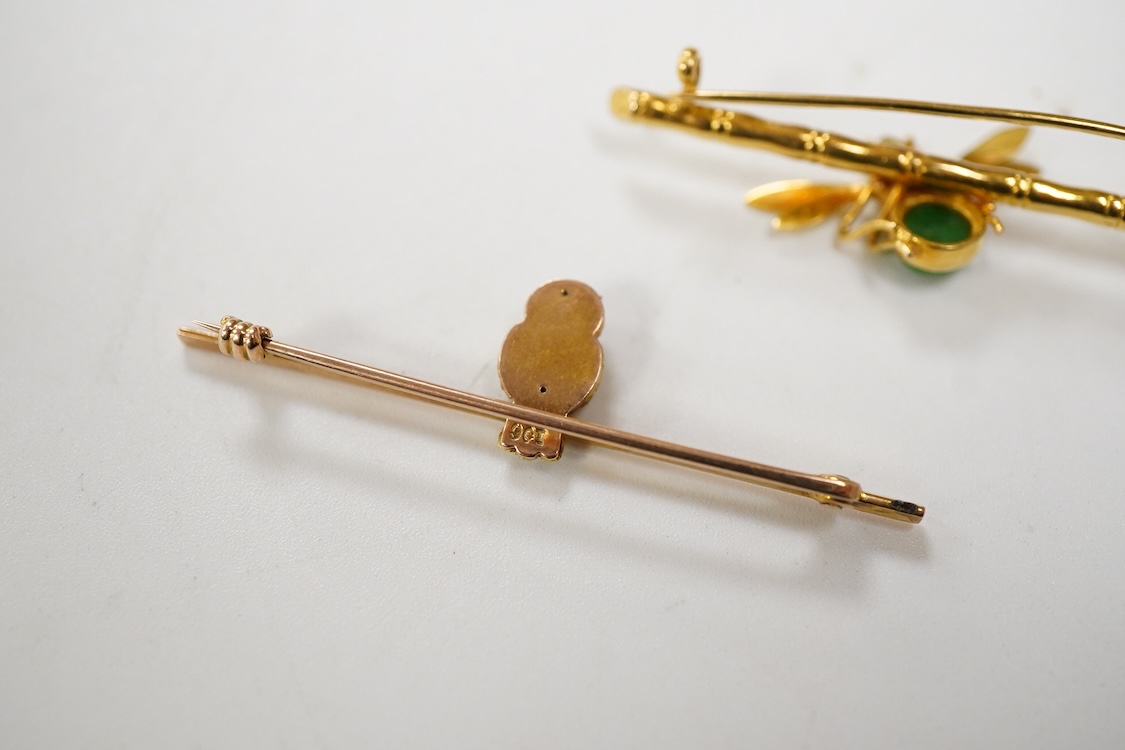 An Edwardian two colour 9ct owl bar brooch, with green cabochon eyes, 48mm, gross 2.5 grams, together with a yellow metal (stamped 20) and single stone cabochon jade set bug bar brooch, gross weight 3.7 grams.